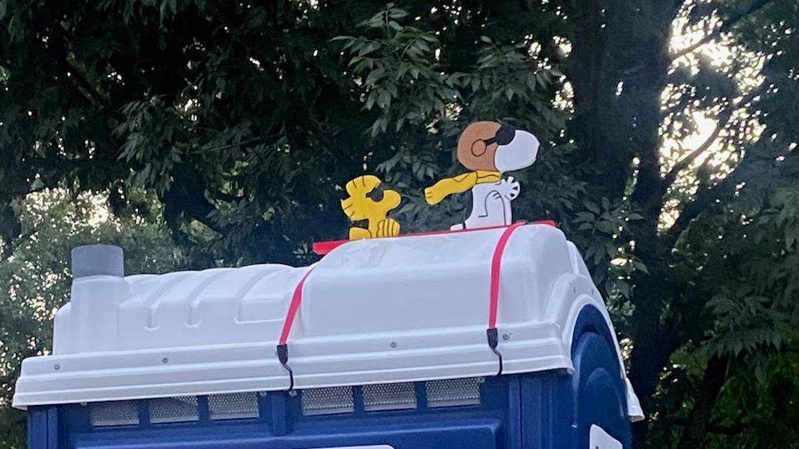 Snoopy and Woodstock flew above the portable toilet since late last summer. Now they’ve disappeared and the homeowners would like them to come home.