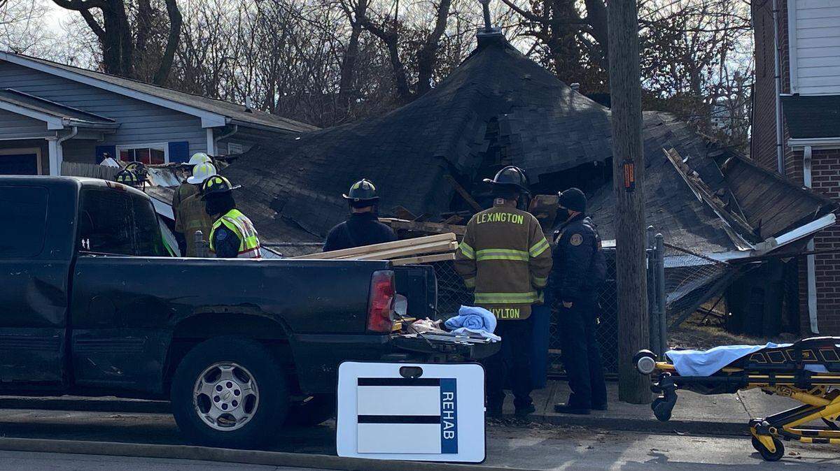 Firefighters worked at the scene of a house that collapsed during demolition on Merino Street Saturday.
