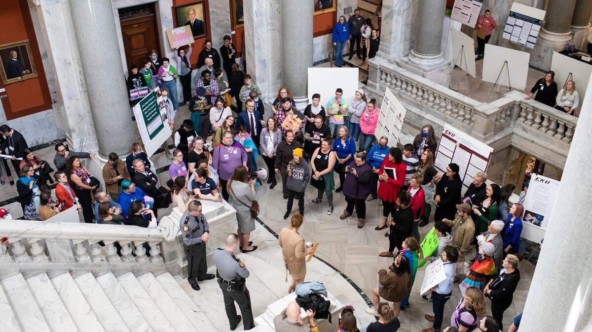 Protestors gather outside the House of Representative chambers while comments are heard on HB 470 at the Capitol in Frankfort, Ky., Thursday, March 2, 2022.