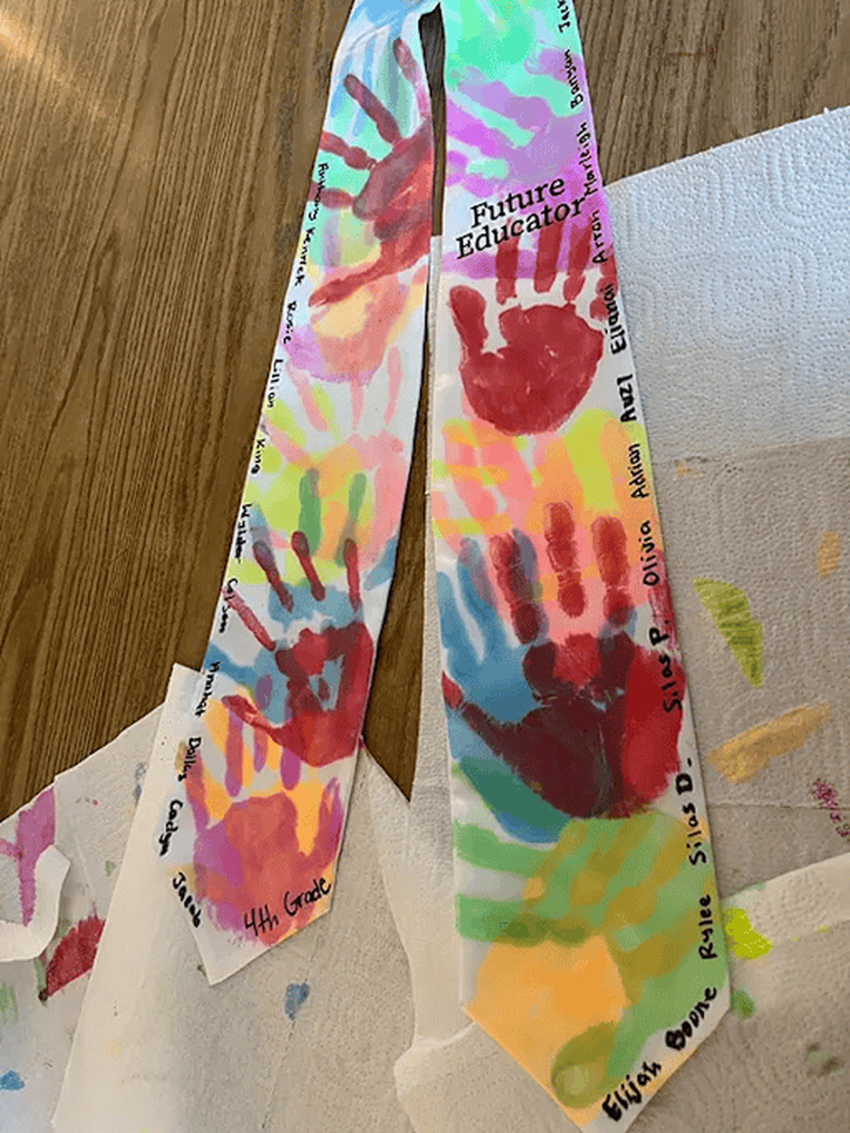Frederick Douglass senior Alayshia Catching returned to Lexington’s Dixie Magnet as a teaching assistant, inspiring students and preparing to major in elementary education. Alayshia has her students’ handprints on her graduation stole.