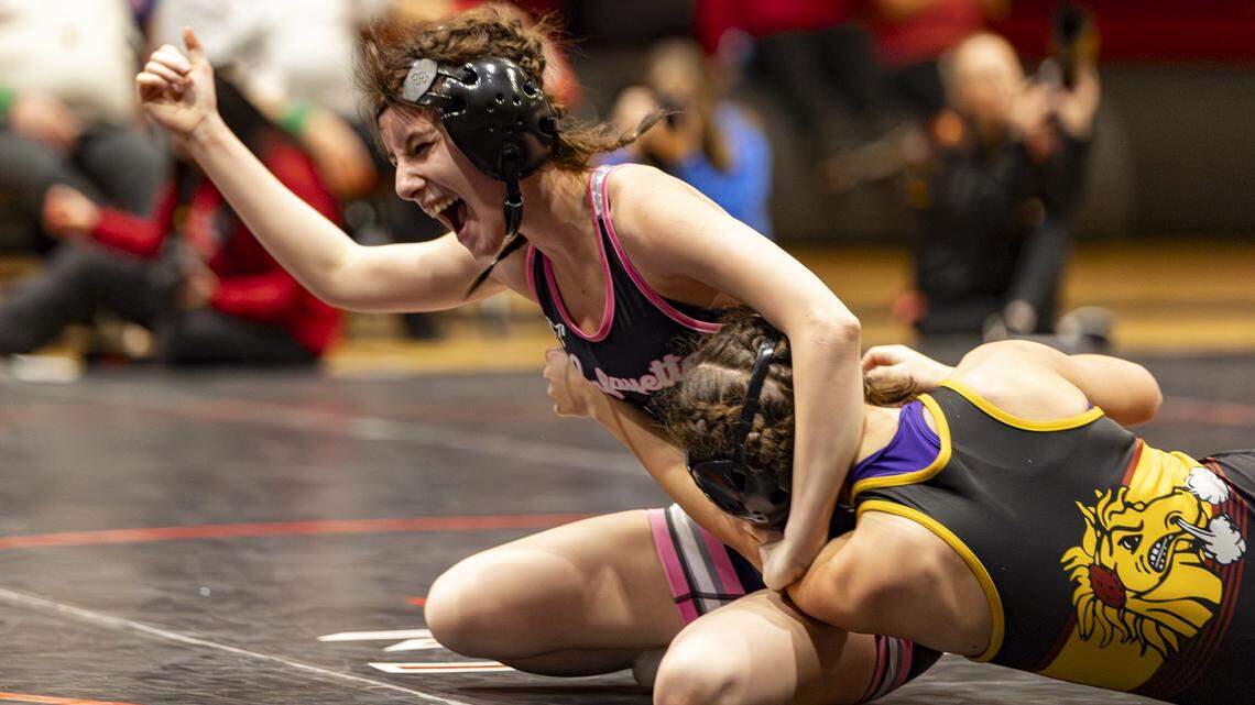Lafayette’s Katelyn Adams celebrates her pinfall win over Harrison County’s Loralei Nelson after the referee’s whistle blew in the 100 finals at the KHSAA Girls Region 3 Wrestling Championships at Robert D. Campbell Jr. High in Winchester on Saturday.