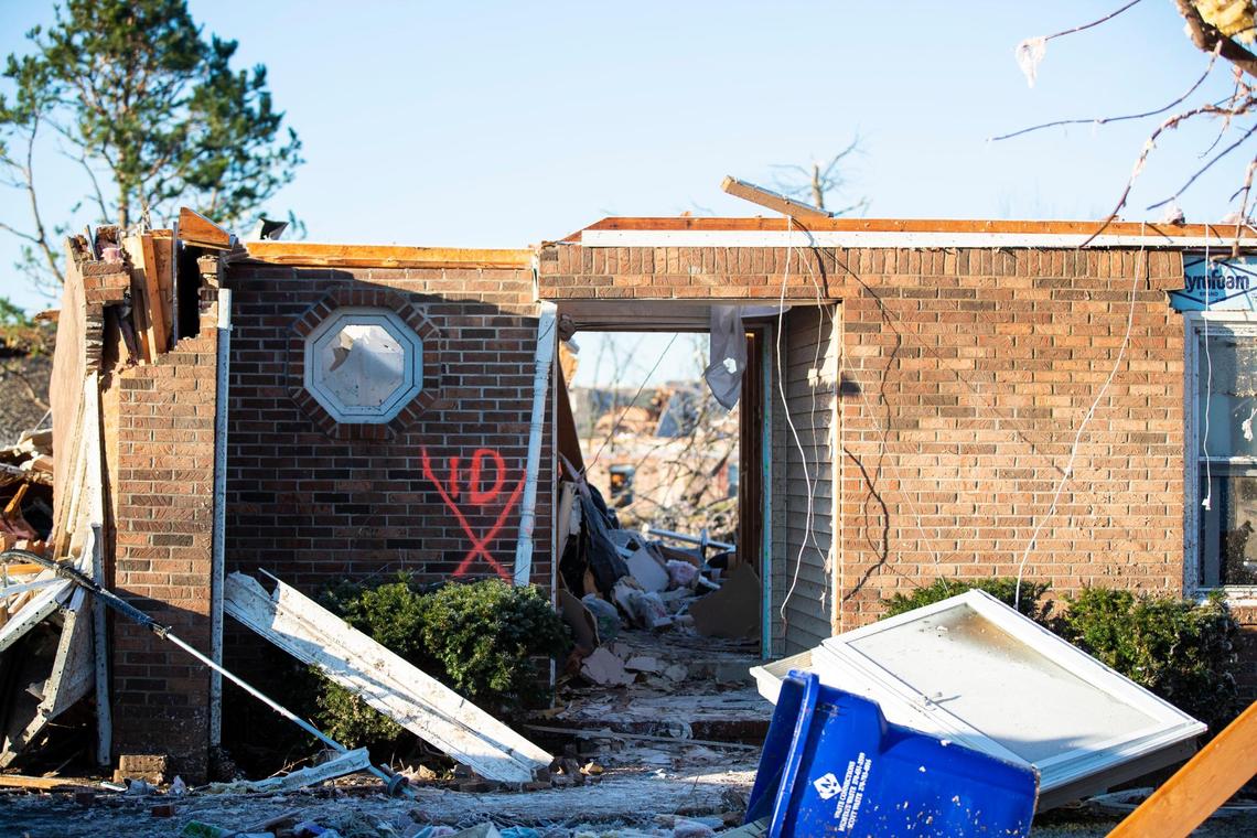 A house hit by a Western Kentucky tornado is marked with an “x” after being searched for survivors in Bowling Green, Ky., Sunday, December 12, 2021.