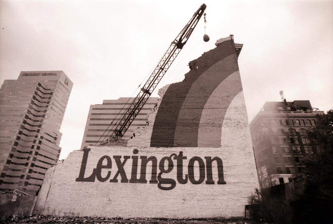 The Lexington rainbow logo was about all that remained of the former Philip Gall & Son sporting goods building at 230 West Main St. in downtown Lexington, as workmen took down the last wall on October 26, 1983. The space was being cleared for a downtown retail and office complex called the Lexington Galleria, to be developed by the Webb Companies. This and the adjacent World Coal Center never happened. Instead the Lexington Financial Center (commonly known as the Big Blue Building) was developed. The site shown here is now the location of its parking garage. Student of history? Fan of all things Lexington and Kentucky? Our blog, KYphotoarchive.com, is updated daily showcasing the Herald-Leader’s vast collection of photographs dating back nearly a century.