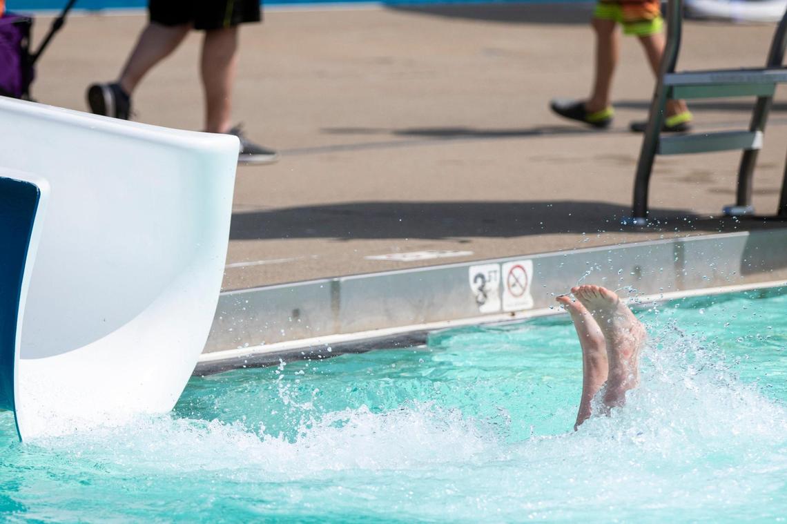 Children play on and near the newest pool feature at the Woodland Aquatic Center: Paradise Lagoon, a shipwreck-themed feature at Woodland Aquatic Center at Woodland Park in Lexington, Ky., Friday, May 26, 2023.