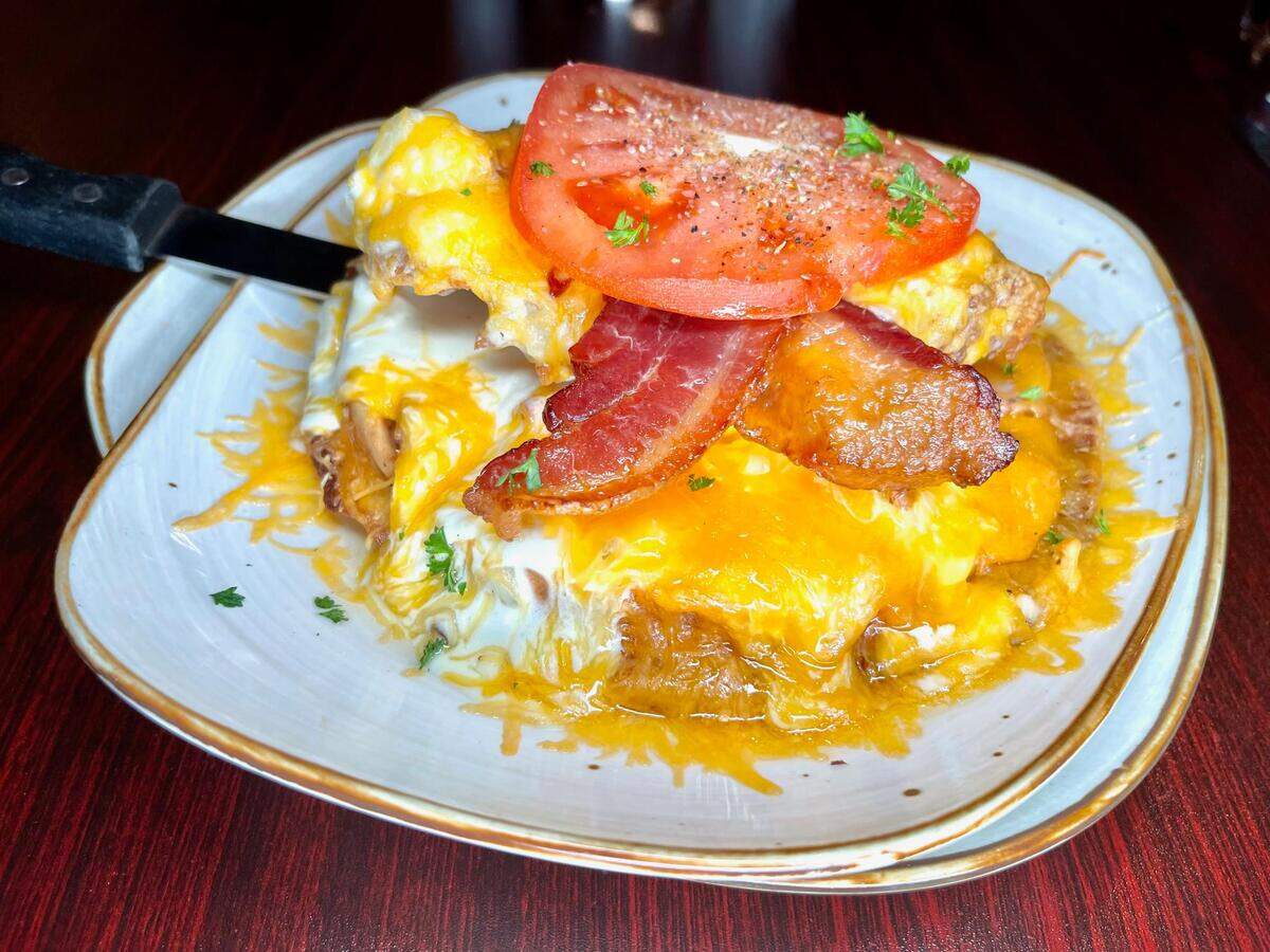 Old Vine Bistro’s version is made with bourbon fried chicken on a candied pecan waffle.
