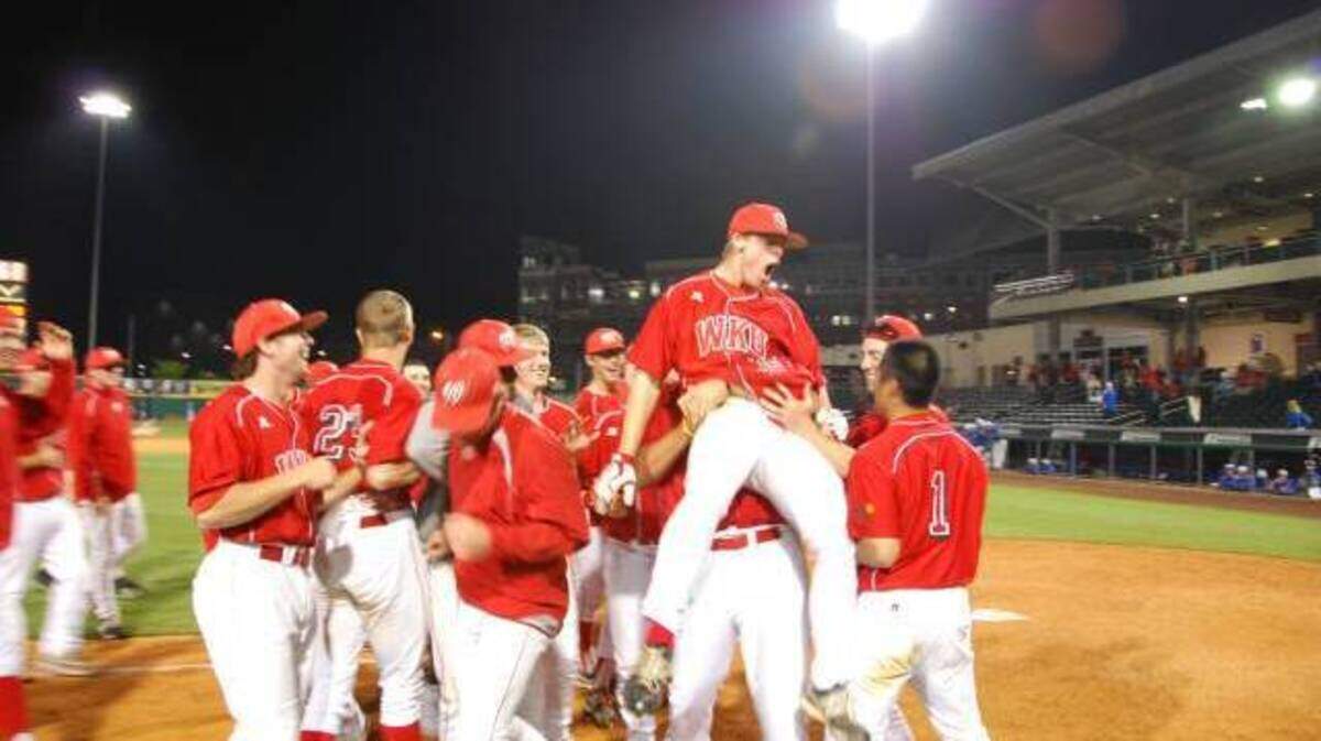 Western Kentucky players celebrated after Trevor Lowe's home run in the bottom of the 18th inning game them a 3-2 victory over Kentucky early Wednesday morning at Bowling Green Park.