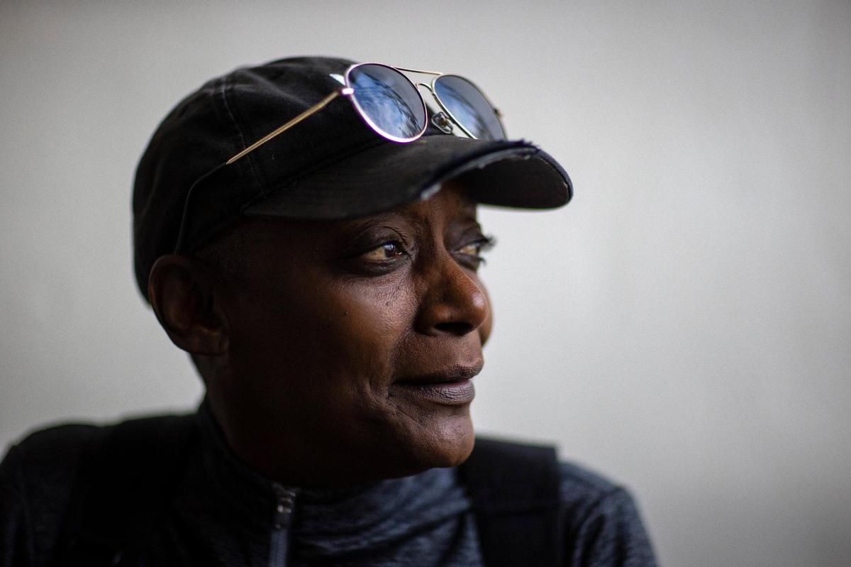 Toby Benjamin of Mayfield sits outside the entrance to the Kenlake State Resort Park in Hardin, Ky., on Tuesday, Dec. 21, 2021. Benjamin was staying there after a tornado ripped through Mayfield, Ky., earlier in December.