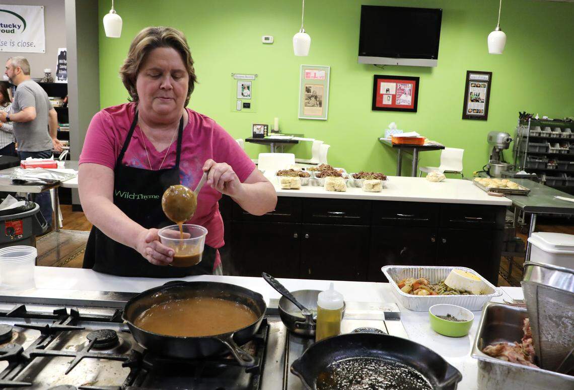 Wild Thyme Cooking executive chef Shawn Caudill ladled up gravy Thursday for a family meal.
