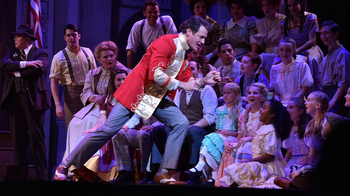 Harold Hill (Edward Watts) makes his pitch for a boys band in “Seventy-Six Trombones.” The Lexington Theatre Company presents “The Music Man” July 12 to 15 at the Lexington Opera House.
