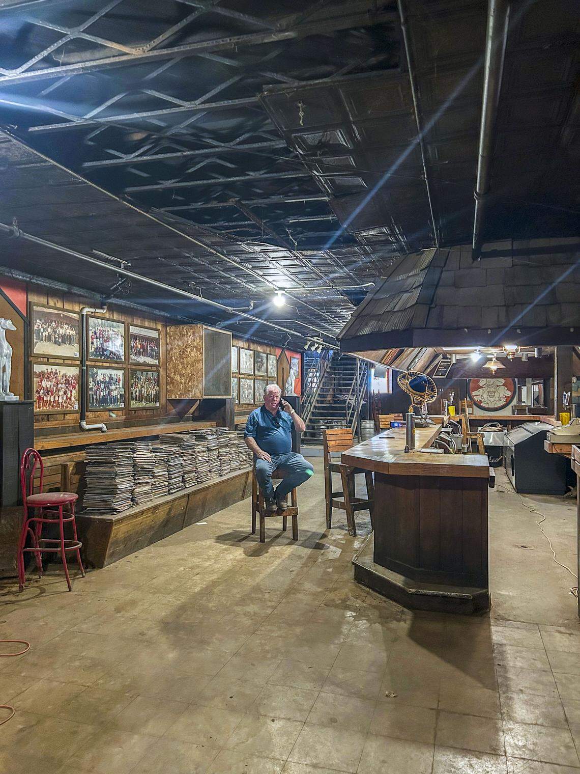 Robbie Robertson sits in at the bar of The Family Dog, which has sat largely untouched since it closed more than 26 years ago. The new owners plan to keep much of the popular EKU college bar as is, including vintage equipment and decor.