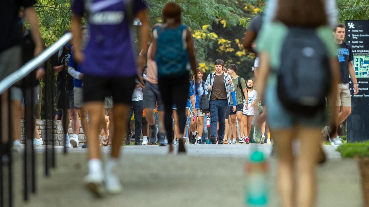Students walk along the University of Kentucky campus in Lexington, Ky., on the first day of classes for the fall semester Monday, Aug. 23, 2021.