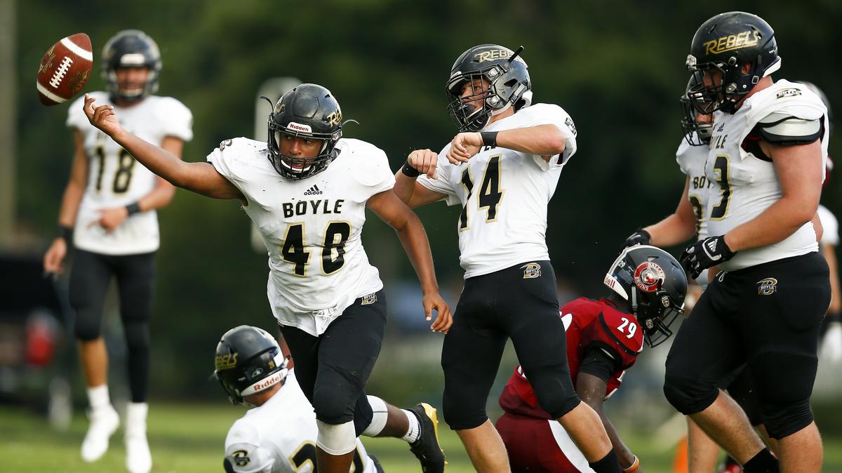 Boyle County’s Ezarious Roller (48) celebrated with teammate Hayden Bottoms (14) after intercepting the ball during the Little Caesars Ft. Harrod Bowl Saturday at Alvis Johnson Field in Harrodsburg. Boyle County beat Ballard 35-21.