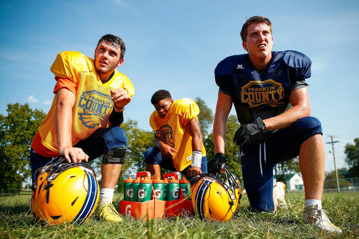 From left, Owen Keleman, Kendall Roederer and Brady Holleran took a break during practice at Franklin County High School.