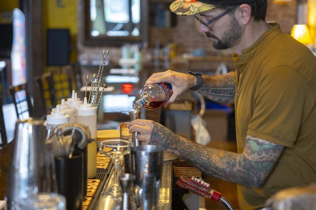 Sean McClary, owner of the new Mulberry Street Bar & Kitchen in Lexington, Ky., prepares a drink on Wednesday, July 8, 2026.