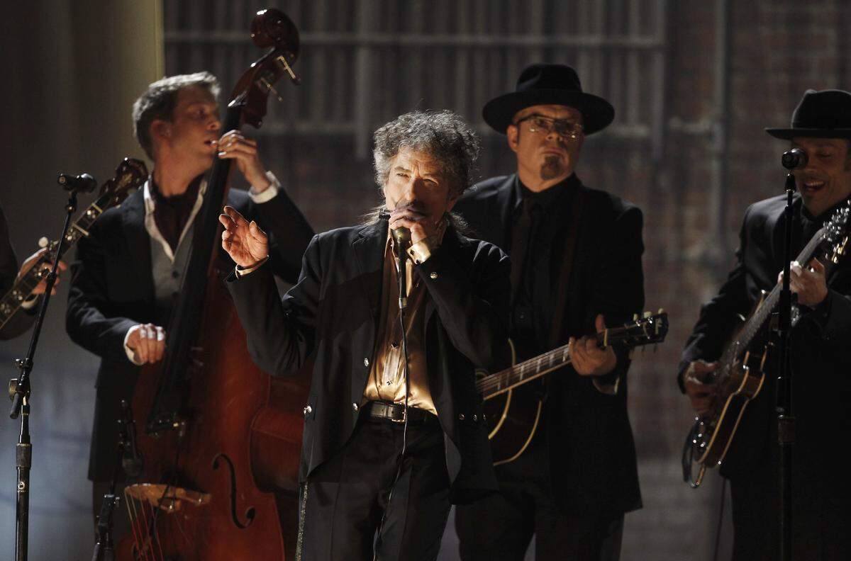 Bob Dylan, center, performs at the 53rd annual Grammy Awards in 2011.