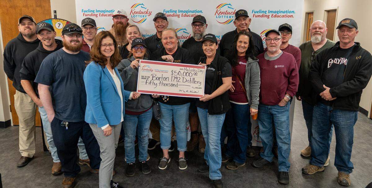 A group of Barton 1792 Distillery workers pooled their money and landed a big Powerball win. Here they can be seen posing with their winnings.