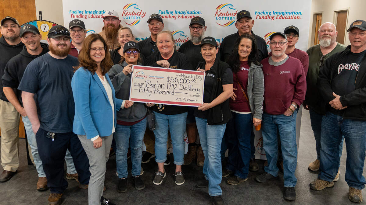 A group of Barton 1792 Distillery workers pooled their money and landed a big Powerball win. Here they can be seen posing with their winnings.