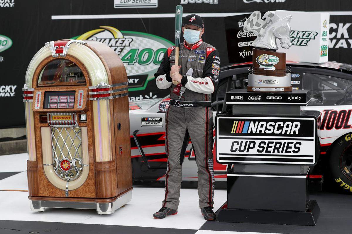 Cole Custer (41) celebrated with the various prizes that come with winning the Quaker State 400 Presented by Walmart.