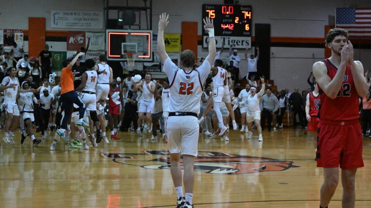 Drew LaMont (22) joined in the celebration Wednesday in Georgetown after the Tigers held off Indiana Wesleyan to advance to the NAIA Tournament round of 16 in Kansas City, Mo., next week.