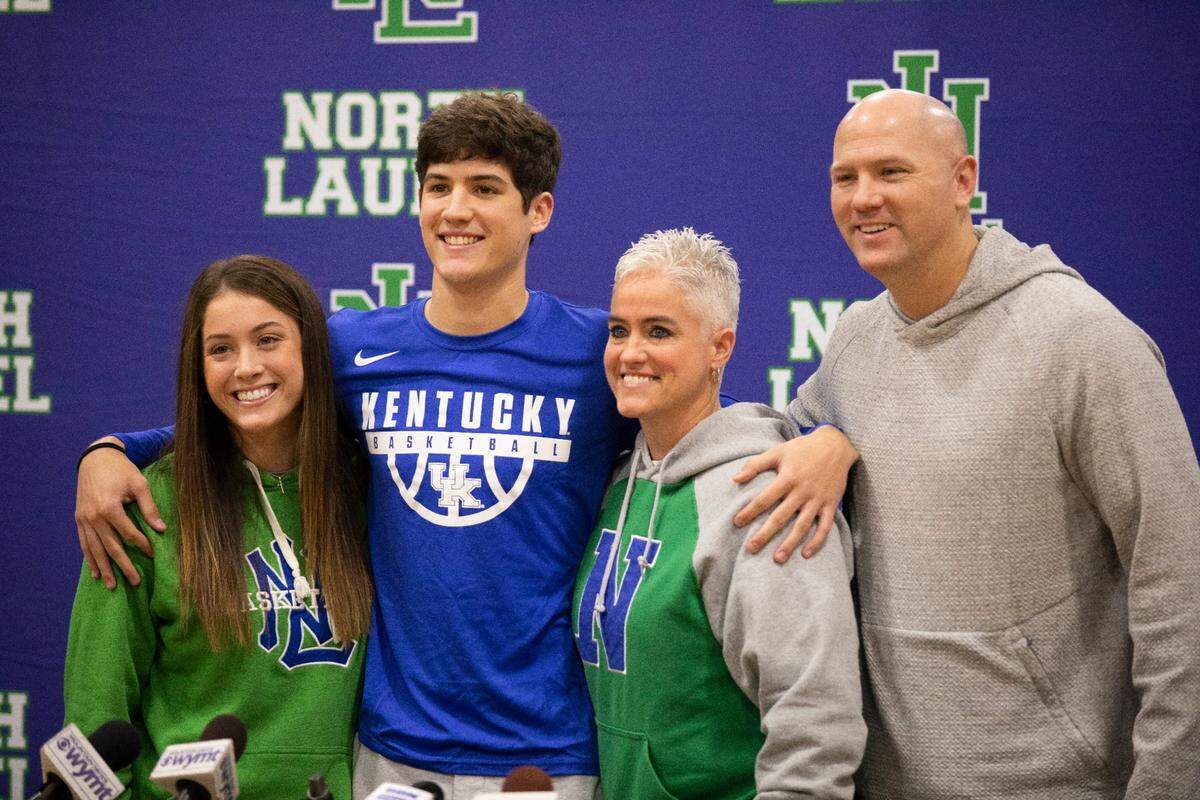 North Laurel High School basketball star Reed Sheppard poses for a photo with his family after announcing his decision to play for the University of Kentucky on Saturday. Reed is pictured with his sister, Madison, and his parents, Jeff and Stacey, who both starred at UK.