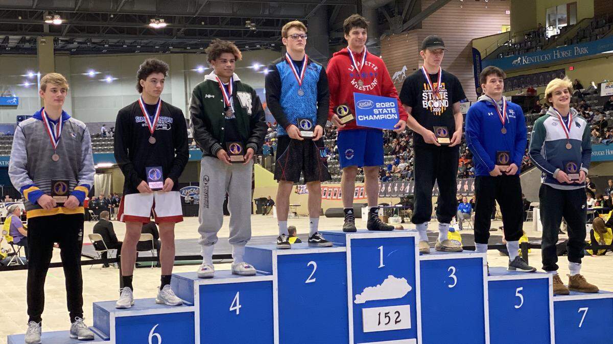 Lafayette’s Brayden Gianonne, center, stood atop the podium as the winner of the 152-pound class at the 2020 KHSAA State Wrestling Championships at the Kentucky Horse Park’s Alltech Arena. This year, Giannone competes at 160 pounds and has qualified for the final round of the state championships to be held at George Rogers Clark High School in Winchester.