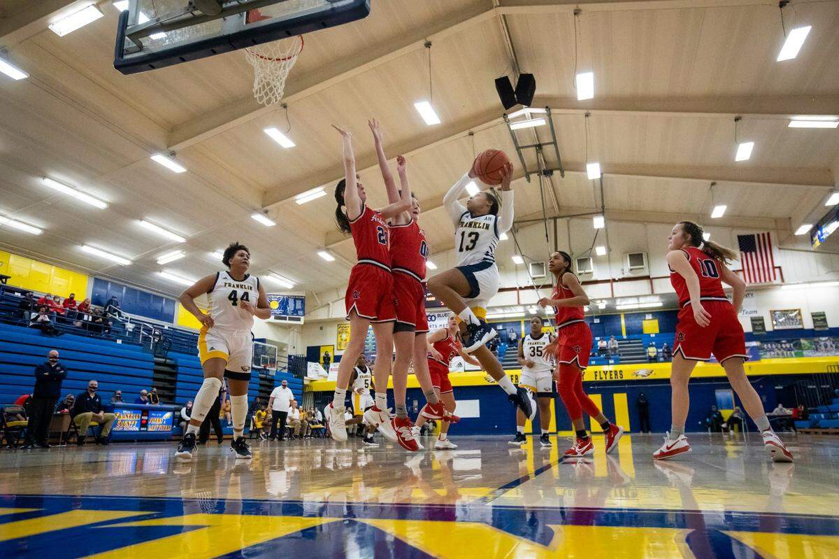 Franklin County’s Brooklynn Miles (13) jumped to score against Anderson County during the first half in Frankfort on Jan. 12.