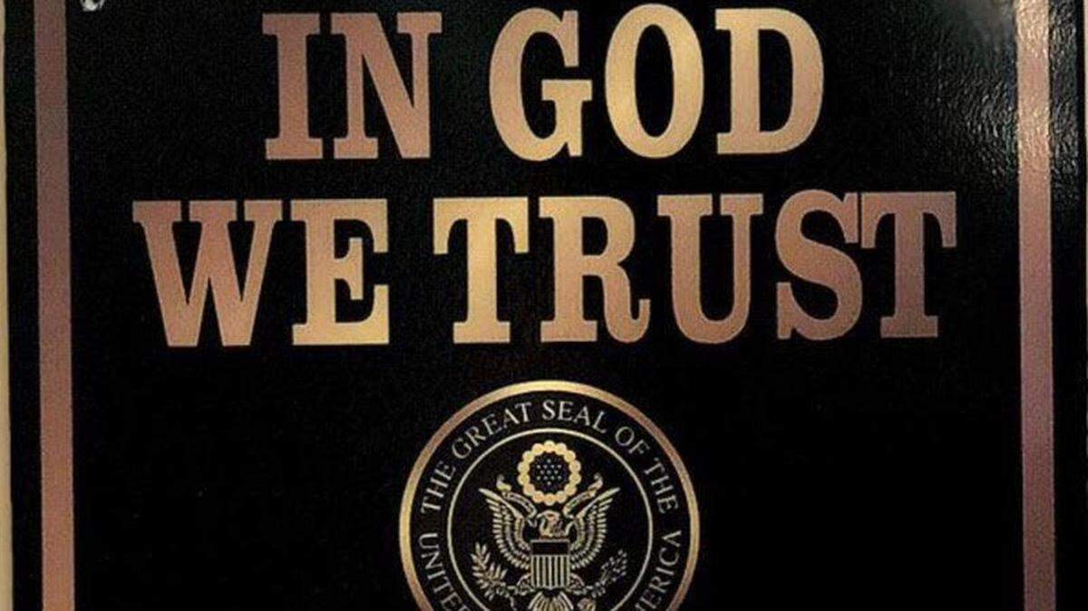 Franklin County Schools chose a black and gold plaque to comply with a new state requirement that each school display the ‘In God We Trust’ motto.