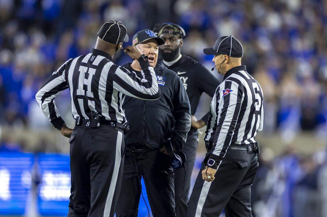 Kentucky head coach Mark Stoops talks to the officials during Saturday’s win over Florida at Kroger Field.