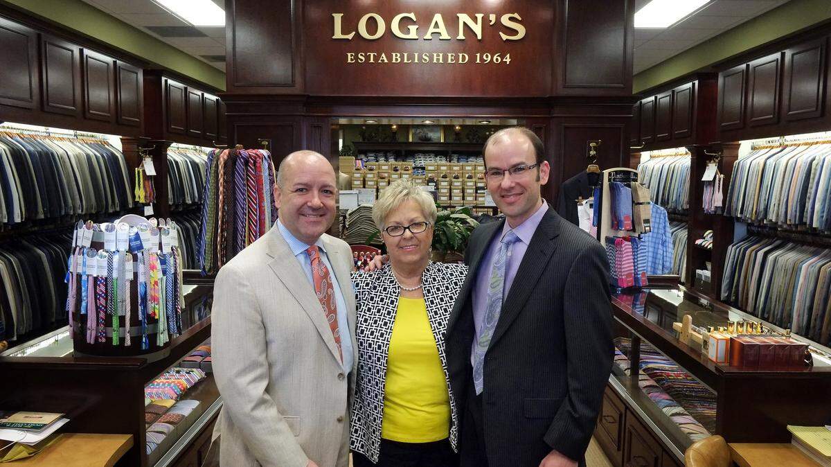 Betty Logan and her sons, Steve, left, and Elliott, at Logan’s of Lexington in 2014 when the store celebrated its 50th anniversary in business. The menswear retailer is opening its new store at Lexington Green on Wednesday.