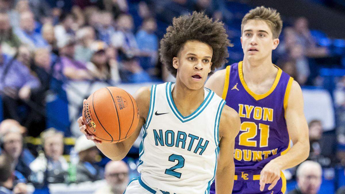 North Oldham's Pierre Rondo (2) drives to the basket past Lyon County's Carson Collins (21) during a first-round game in the 2026 UK Healthcare Boys’ Basketball Sweet 16 onThursday at Rupp Arena.