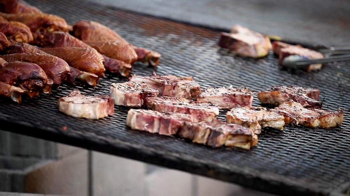 After being marinated for up to 48 hours, pork chops are slow roasted over charcoal at the Bluegrass Fair.
