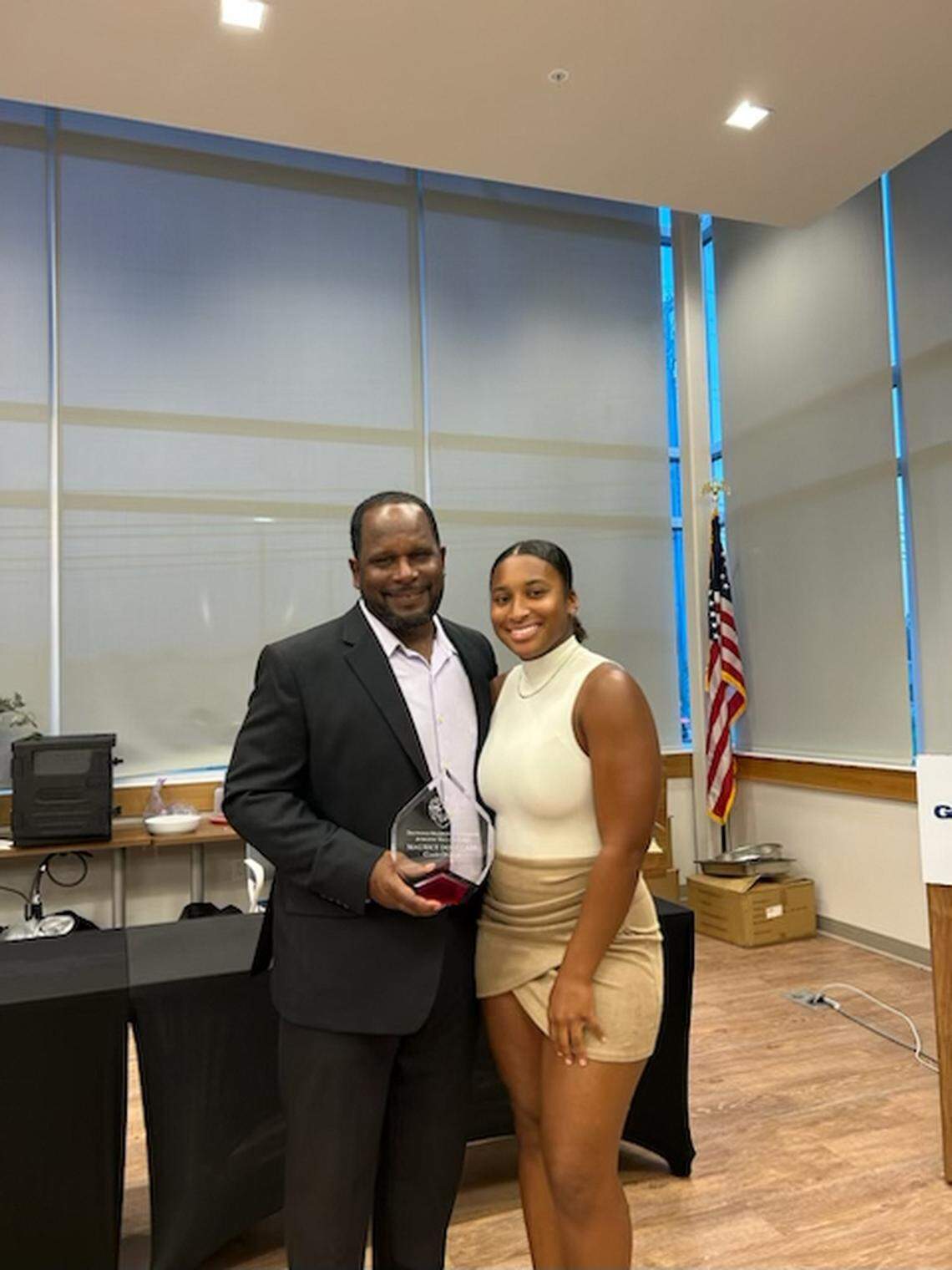 Former Kentucky defensive back, Maurice Douglass, now head football coach at Springfield High School in Ohio, with his daughter, Shiloh, a UK student. “My daughter works for the (UK) football recruiting department,” Maurice Douglass said. “She’s been at UK the last two years.”