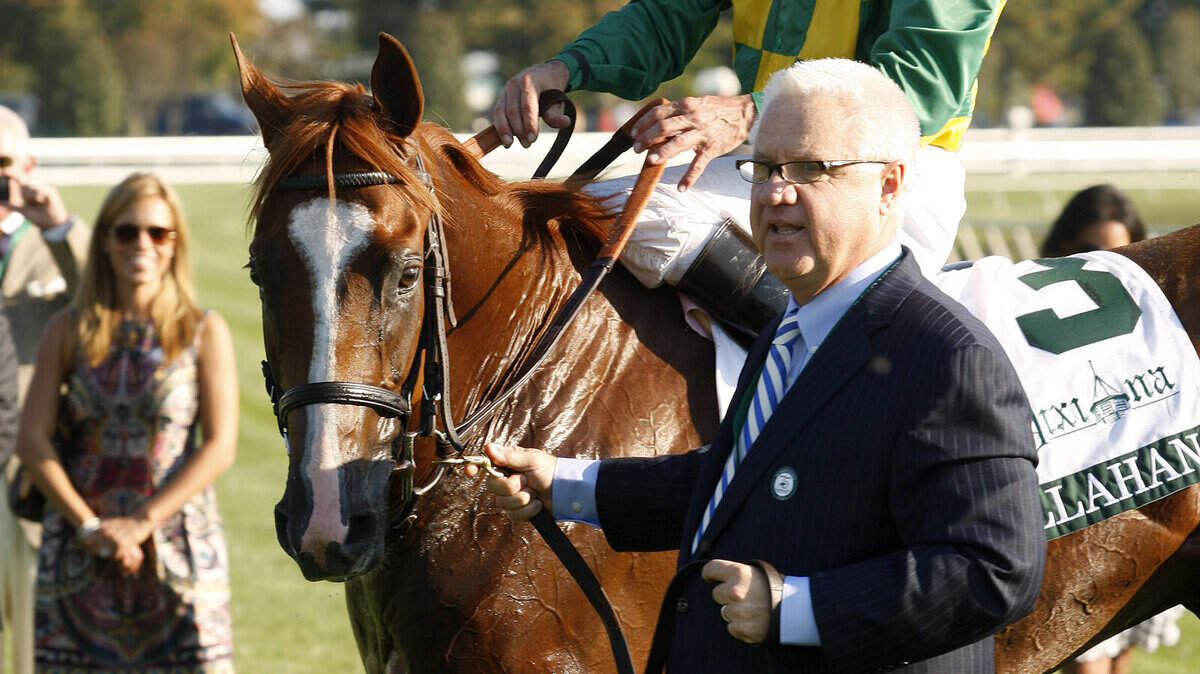 Jerry Crawford leads Donegal Racing's Dullahan, with jockey Kent Desormeaux aboard, to the winner's circle following the Grade 1 $400,000 Dixiana Breeders' Futurity at Keeneland in Lexington Saturday, October 8, 2011. Photo by Matt Goins