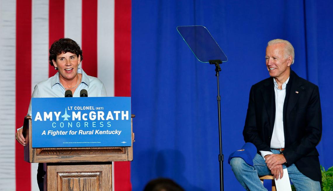 Sixth Congressional District Democratic candidate Amy McGrath spoke as former Vice President Joe Biden looked on, as they appeared Friday afternoon at a fish fry held in the Bath County High School gymnasium in Owingsville, Ky. Biden was campaigning for McGrath, who is running against Republican incumbent U.S. Rep. Andy Barr.
