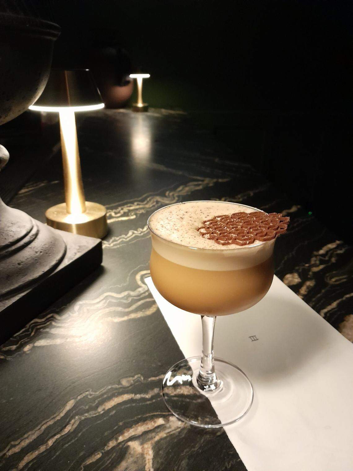 The drink menu at Trifecta Glass Art Lounge changes every three months with both a new gallery show and a new cocktail menu.