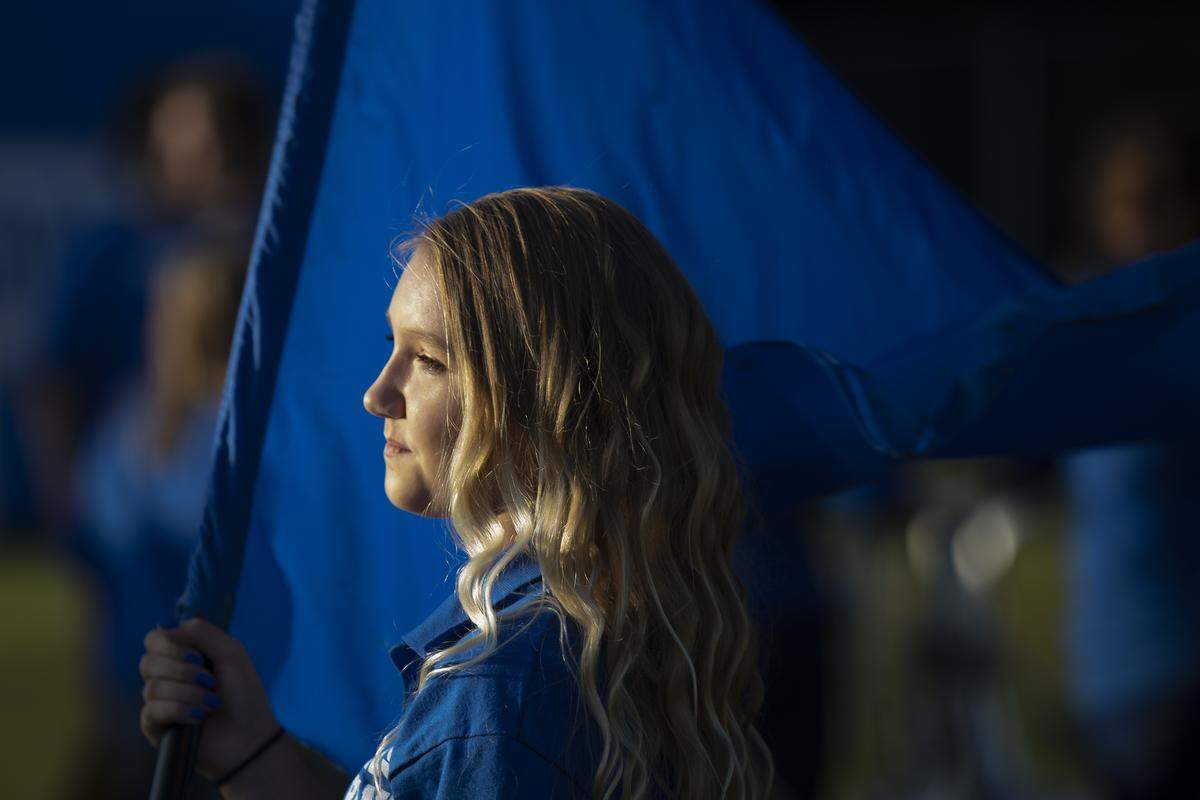 Zyanna Gay, an eighth grader, waits to take the field with the Breathitt High School marching band.