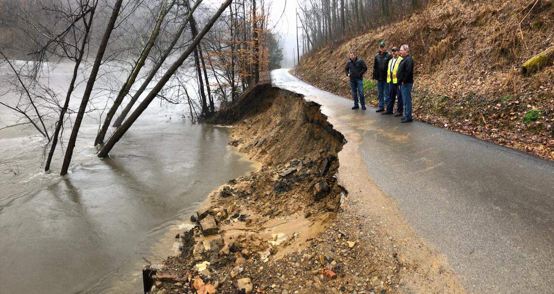 Pike County Judge-Executive Ray Jones, County Commissioner Brian Booth, Road Supervisor Fabian Little and Road Foreman J.B. Dotson evaluated an embankment failure on Woodman Summer Road in Woodman.