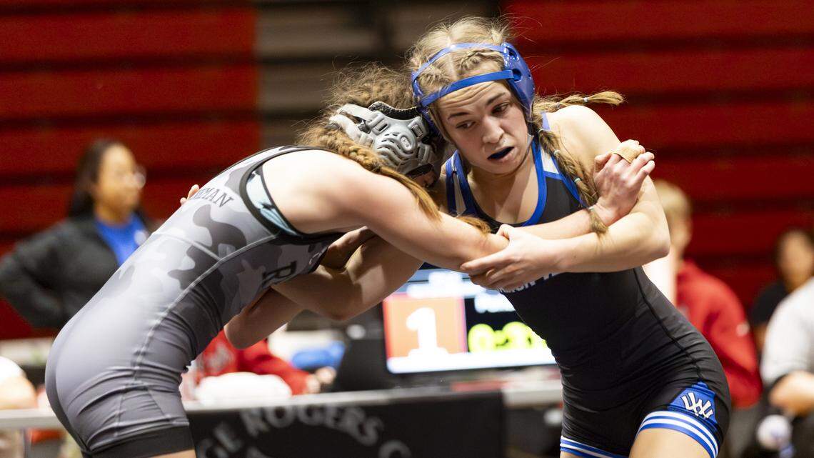 Walton-Verona’s Emma Moore grapples with Ryle’s Peyton Brinkman in the 107 finals at the KHSAA Girls Region 3 Wrestling Championships at Robert D. Campbell Jr. High in Winchester on Saturday.