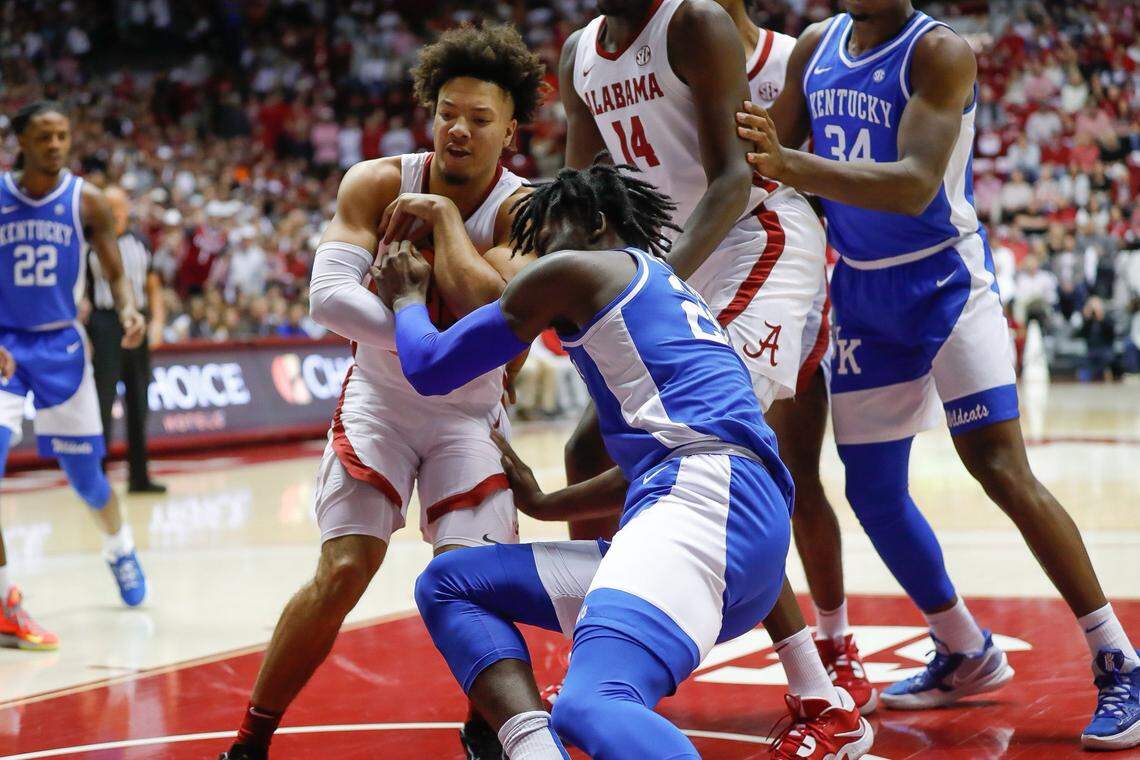 Kentucky’s Cason Wallace fights for the ball against Alabama on Saturday, Jan. 7, 2023, in Tuscaloosa, Ala.