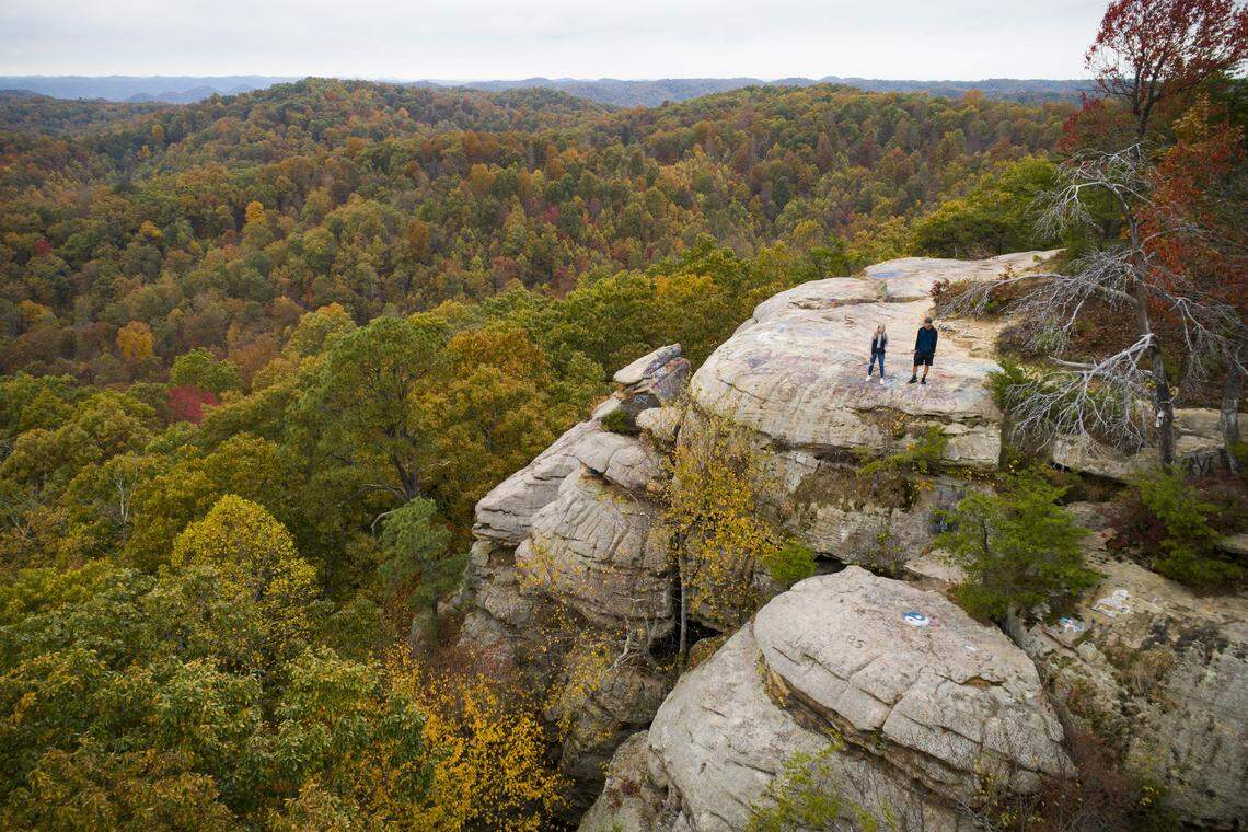 Alissa Myers and Matthew Myers, both of Salt Lick, Ky., view changing fall foliage in the Daniel Boone National Forest from Lockegee Rock near Morehead, Ky., Tuesday, Oct. 29, 2019.