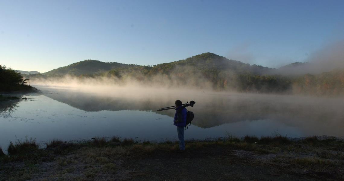 Local photographer James  Archambeault, well known for his natural Kentucky landscapes, was photographed in October 2000 in the Daniel Boone National Forest in Bath County by Clear Creek Lake. 