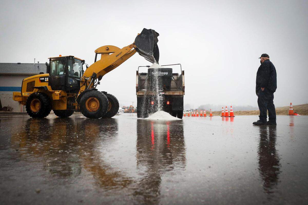 Lexington firefighter Eric Conkright watched as salt is loaded into an LFD salt truck outside of one of the city’s salt barns on Old Frankfort Pike in Lexington Wednesday.