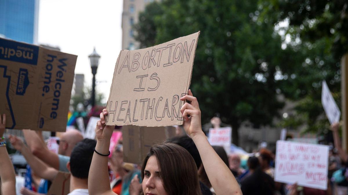 People gather near Robert F. Stephens Courthouse Plaza in downtown Lexington, Ky., on Friday, June 24, 2022 to protest the U.S. Supreme Court’s overturning of Roe v. Wade.