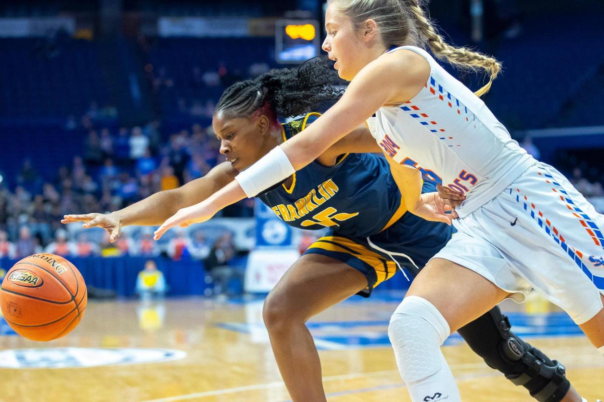 Franklin County’s Jazmin Chambers (15) and Southwestern’s Kaylee Young (5) fight for the ball during Friday’s quarterfinal game in Rupp Arena.