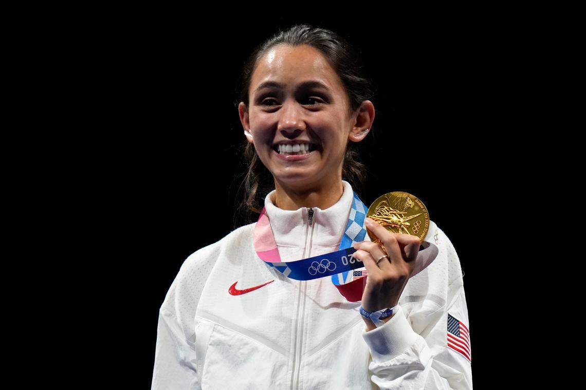 Gold medalist Lee Kiefer of the United States celebrated during the medal ceremony for the women’s individual foil competition at the Summer Olympics on Sunday in Chiba, Japan.