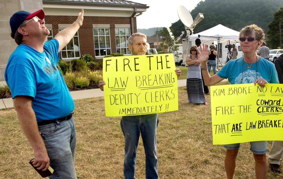 MOREHEAD, KY - SEPTEMBER 9: Protestors hold signs and wave their hands into the air as religious songs are sung in front of Rowan County Courthouse on September 9, 2015 in Morehead, Kentucky. County Clerk Kim Davis was released from jail yesterday after her arrest for contempt of court for refusing to comply with a court order to issue marriage licenses to same-sex couples in her county. (Photo by Ty Wright/Getty Images)
