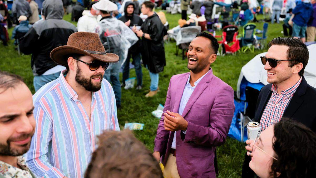 Columbia, South America, native Collin Smith, second from right, laughs with friends from college during the leadup to the 151st running of the Kentucky Derby at Churchill Downs. Smith flew in for it, and for he and his group, it was their first time to the race.