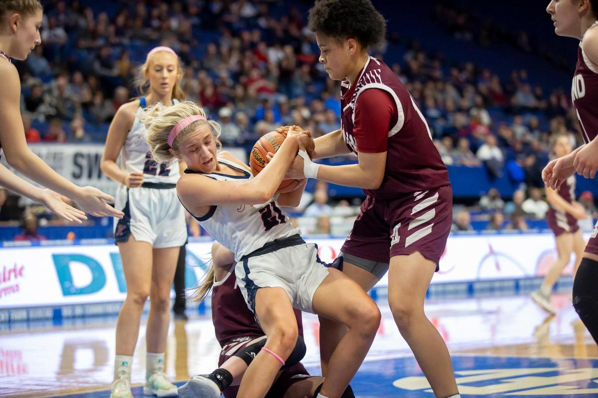 Knott County Central’s Presley Fletcher (21) and Ashland Blazer’s Jaidyn Gulley (12) battle for a loose ball during Thursday’s first-round Sweet 16 game in Rupp Arena. Ashland Blazer held Knott Central to zero points in the first quarter and six in the first half.