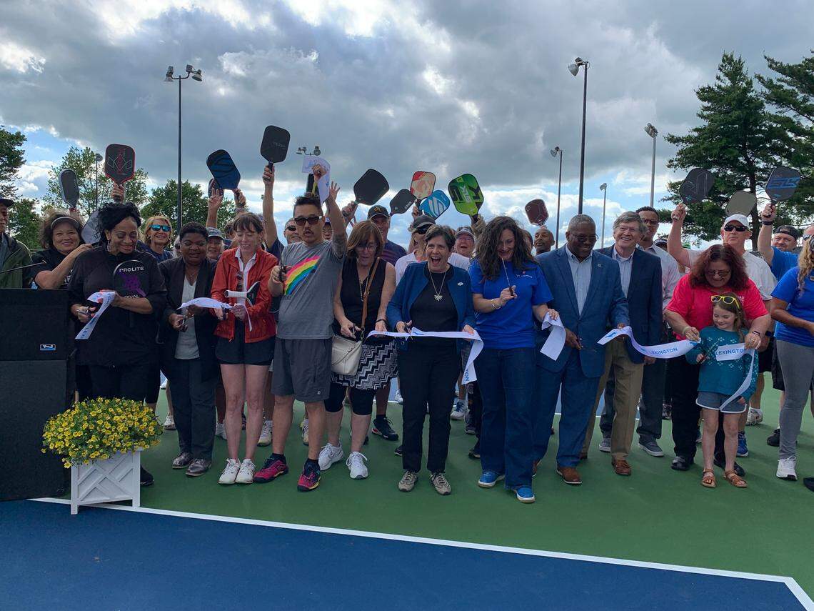 Government officials and pickleball players cut the ribbon on 20 new pickleball and eight new tennis courts at Shillito Park on Wednesday, May 21, 2025.