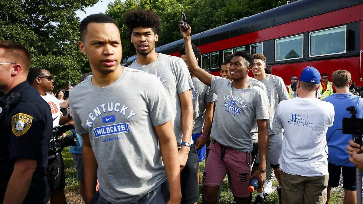 Kentucky basketball players, from left, Jemarl Baker, Nick Richards and Immanuel Quickley arrived with the rest of the team during a train stop as part of the Big Blue Caravan in Midway last month. The team's next big trip will be to the Bahamas for four exhibition games in August to be broadcast live on the SEC Network.